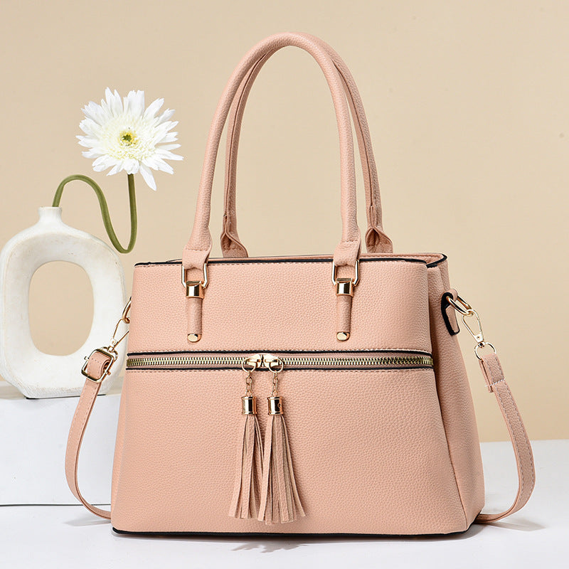 Große weiche Lederquaste-Schultertasche mit hoher Kapazität.