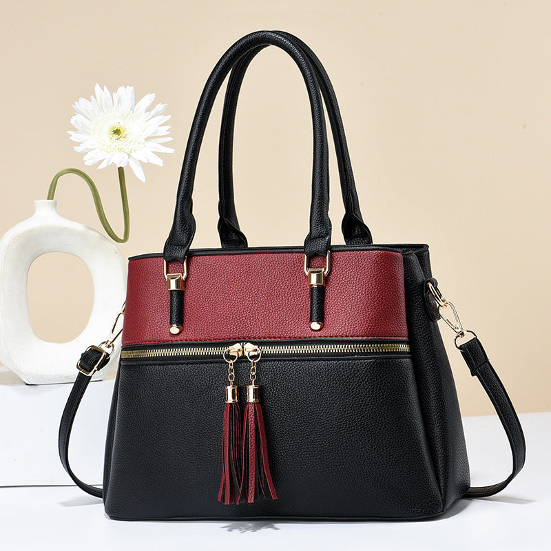 Große weiche Lederquaste-Schultertasche mit hoher Kapazität.
