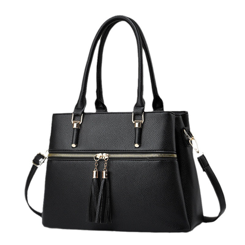 Große weiche Lederquaste-Schultertasche mit hoher Kapazität.