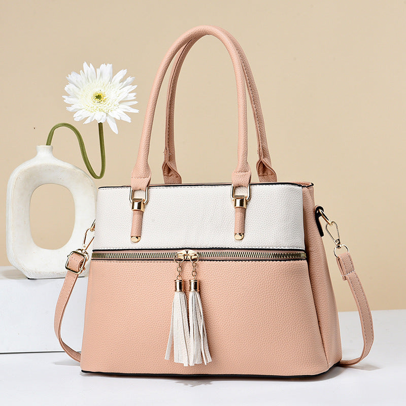 Große weiche Lederquaste-Schultertasche mit hoher Kapazität.